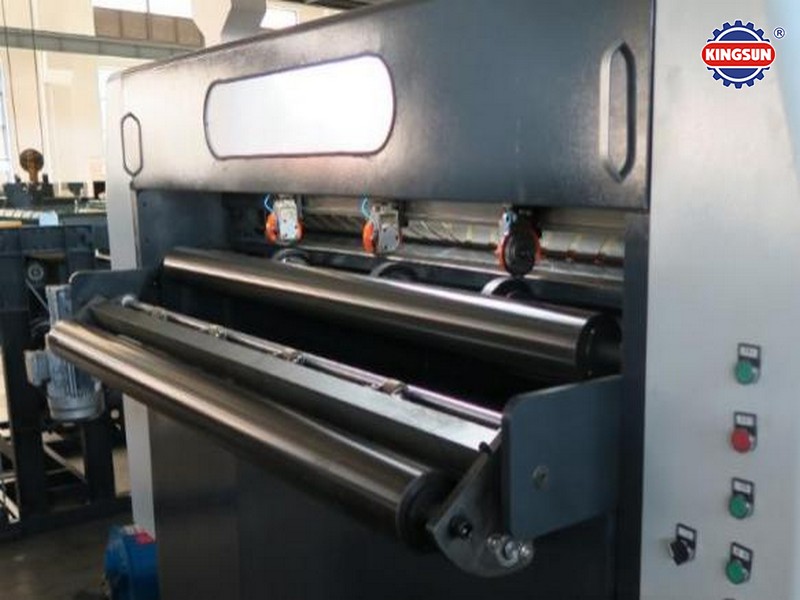 Rotary blade cutting unit of a high-speed sheeter paper machine with high-hardness alloy knives for precision sheeting.